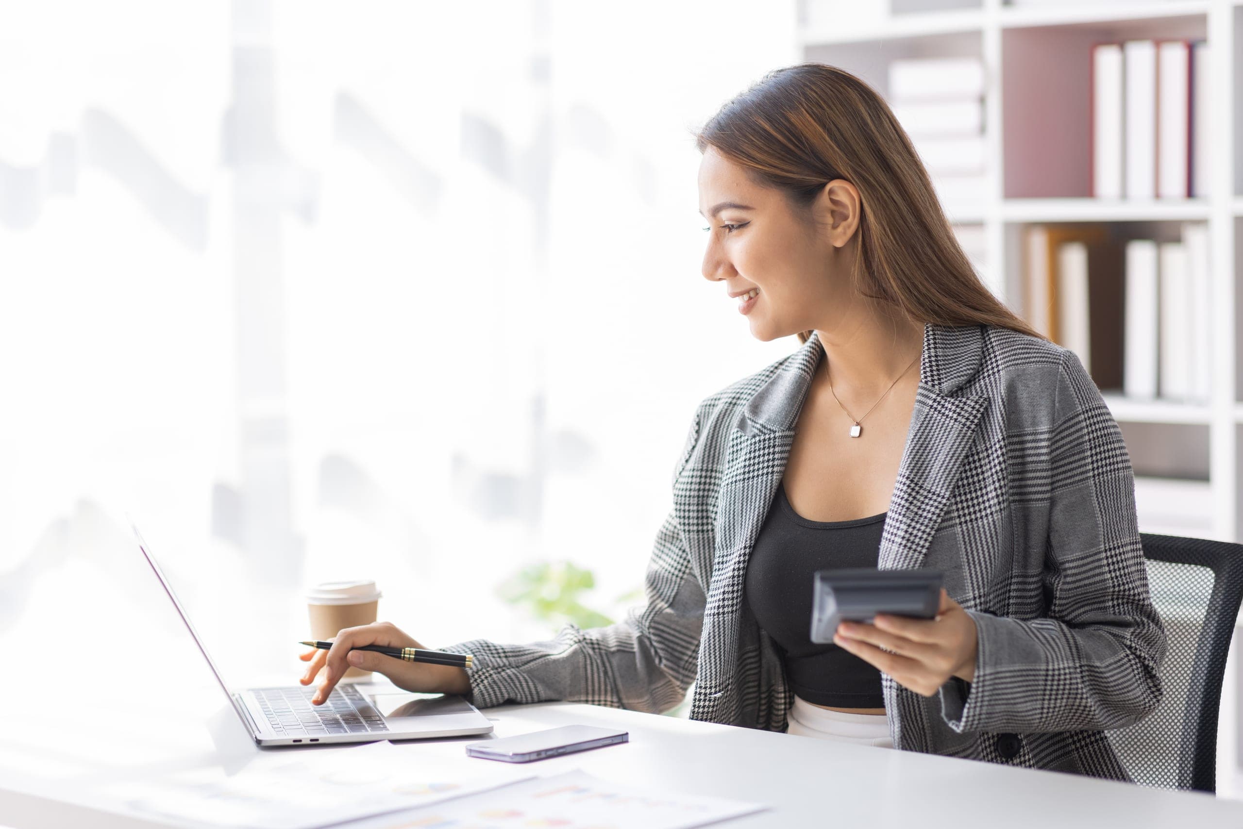 Business manager working at her laptop