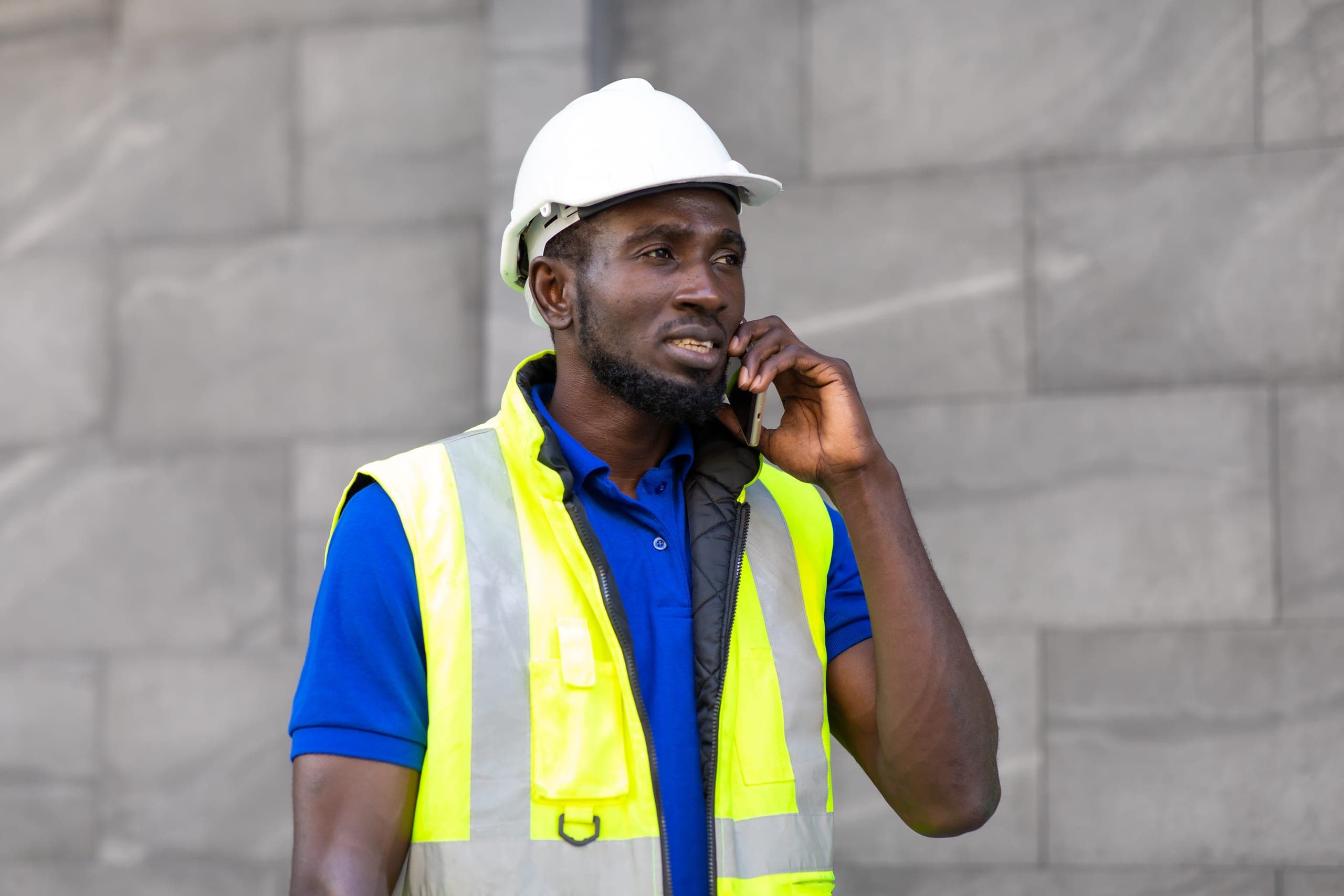 Technician in a hard hat on the phone